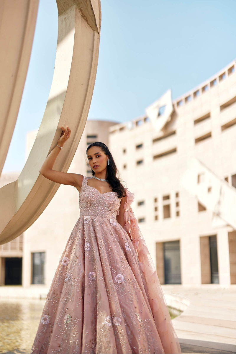 Transform into a fairy tale princess in a specially crafted pink gown 🌸  Adorned with delicate lace flowers and a seductive V-neckline... | Instagram