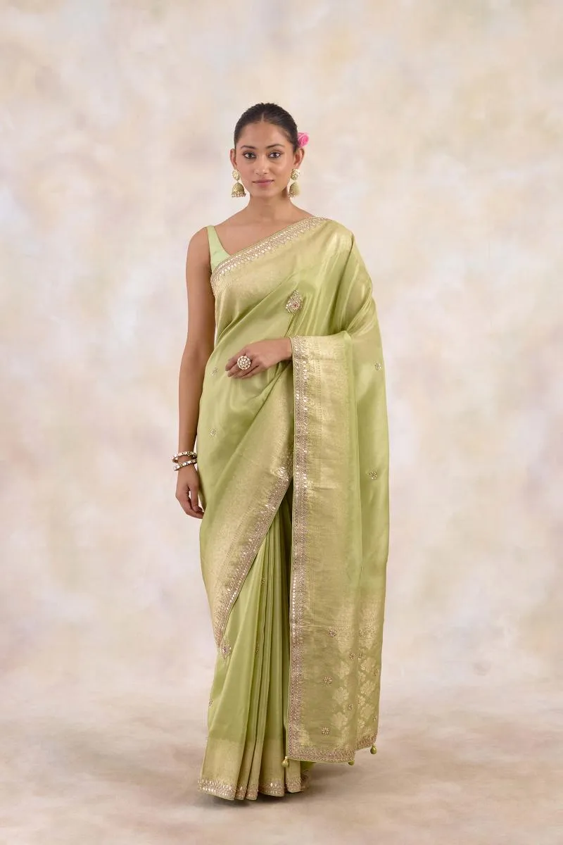 Muted Olive Green Tissue Silk Saree